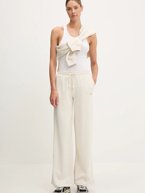 New Balance spodnie dresowe damskie kolor beżowy gładkie WP51503LIN