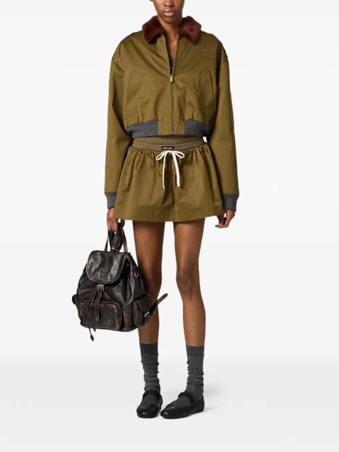 Miu Miu logo-detail flared mini skirt - Green