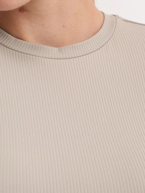 New Balance t-shirt treningowy damski kolor beżowy WT53125ADS