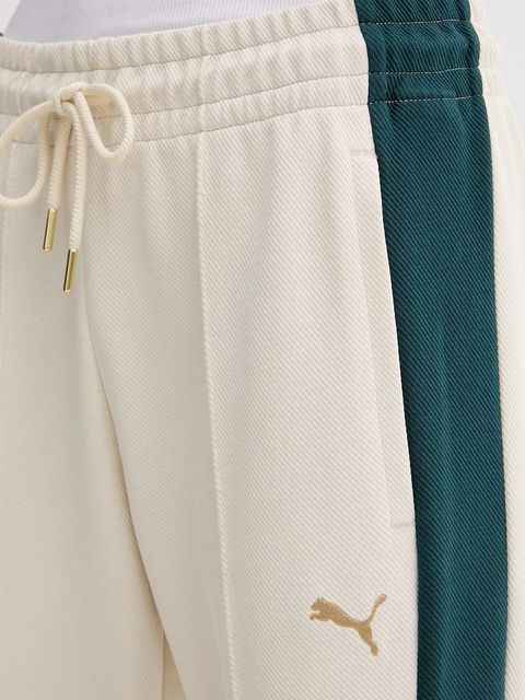 Puma spodnie dresowe damskie kolor beżowy wzorzyste 632138