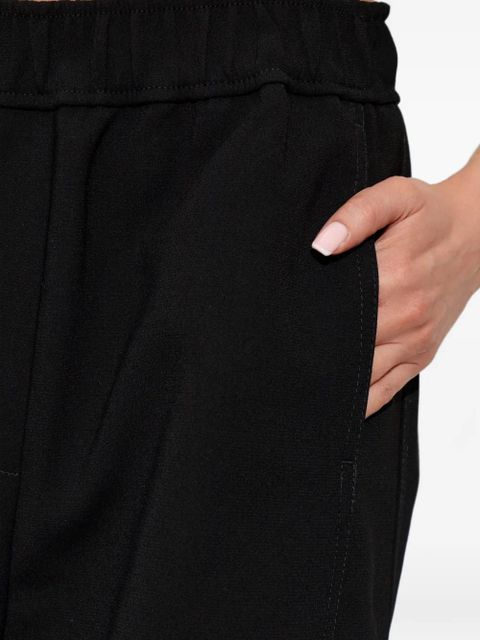 GANNI elasticated-waist trousers - Black