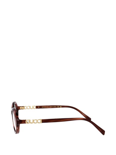 Gucci Eyewear logo-plaque round-frame glasses - Brown