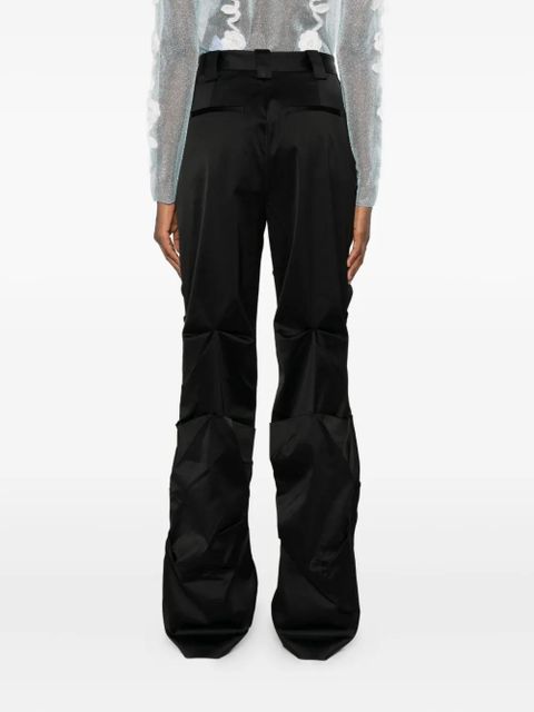 GANNI logo-plaque trousers - Black