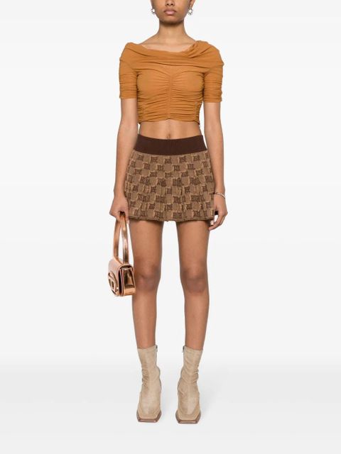 MISBHV monogram-jacquard pleated mini skirt - Brown