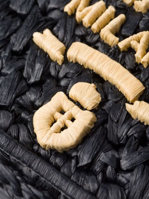 Prada logo-embroidered interwoven shoulder bag - Black