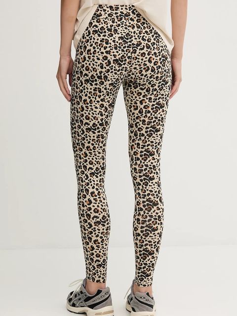 Puma legginsy damskie kolor beżowy wzorzyste 688085