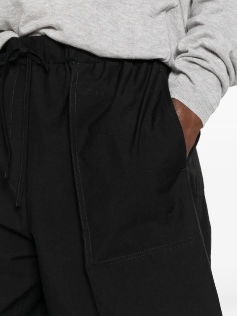 TOTEME drawstring patch-pocket trousers - Black