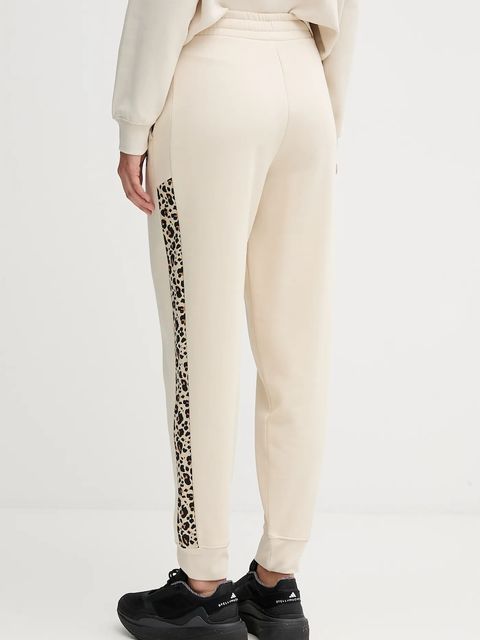 Puma spodnie dresowe damskie kolor beżowy wzorzyste 688086