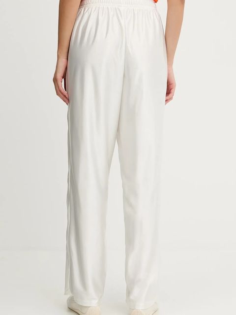 Puma spodnie dresowe PUMA x FENTY damskie kolor beżowy 635746