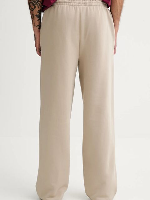 Pangaia spodnie dresowe bawełniane kolor beżowy gładkie 10002676