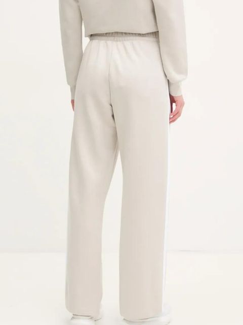 adidas spodnie dresowe Essentials kolor beżowy wzorzyste JW9215