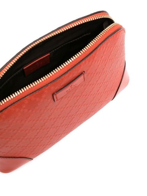 Gucci embossed logo-patch makeup bag - Orange