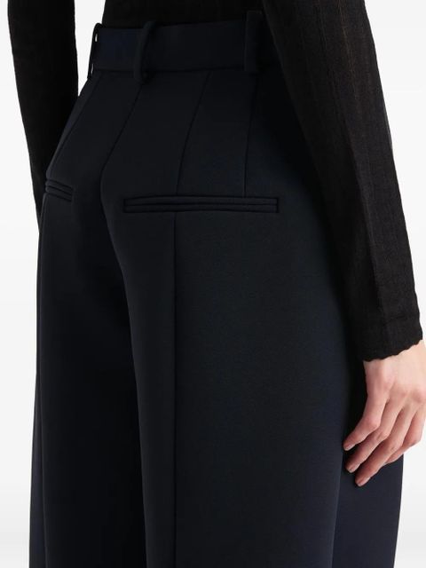 KHAITE button-detail pleated trousers - Blue