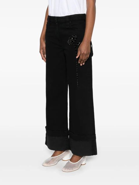 Simone Rocha Carnation-embellished jeans - Black