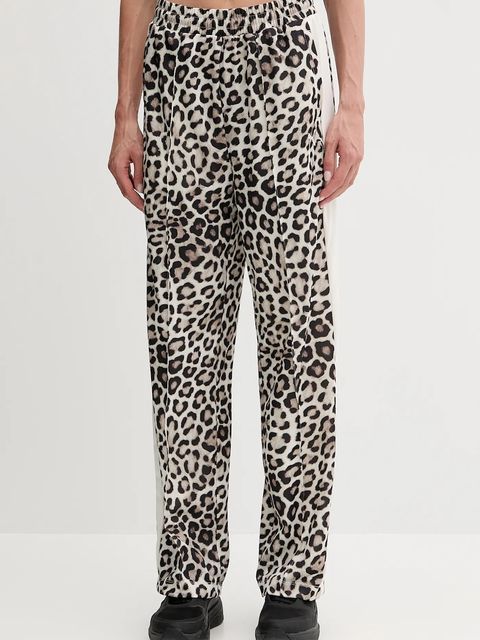 Puma spodnie dresowe damskie kolor beżowy wzorzyste 632343