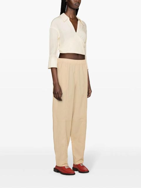 GANNI Curve tapered-leg trousers - Neutrals