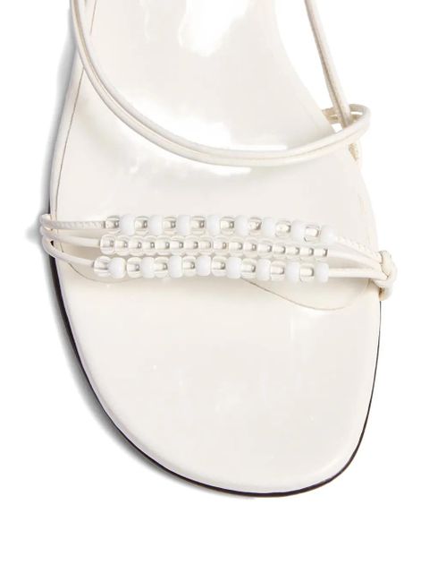 KHAITE bead-embellished loop flat sandals - White