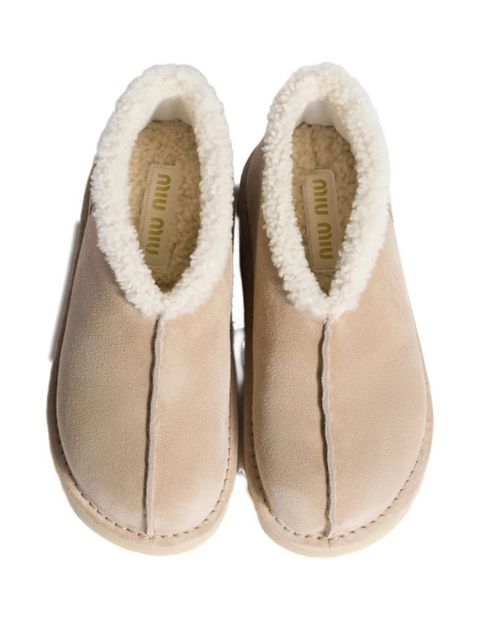Miu Miu embroidered-logo shearling boots - Neutrals