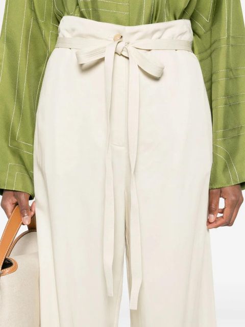TOTEME belted-waist flared trousers - Neutrals
