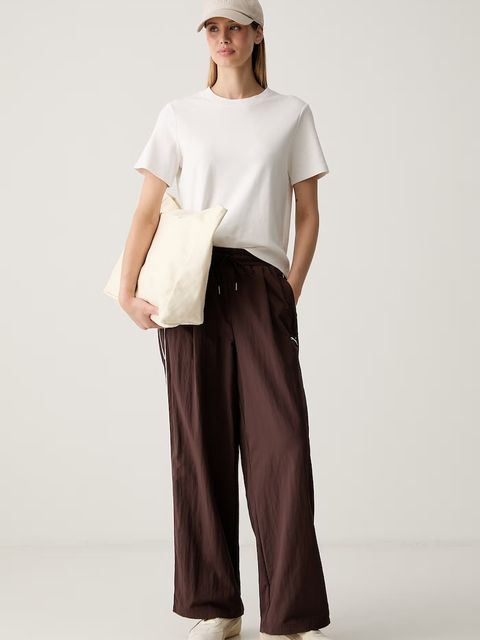 Puma spodnie dresowe damskie Piping Relaxed Woven - zdjęcie produktu nr 1