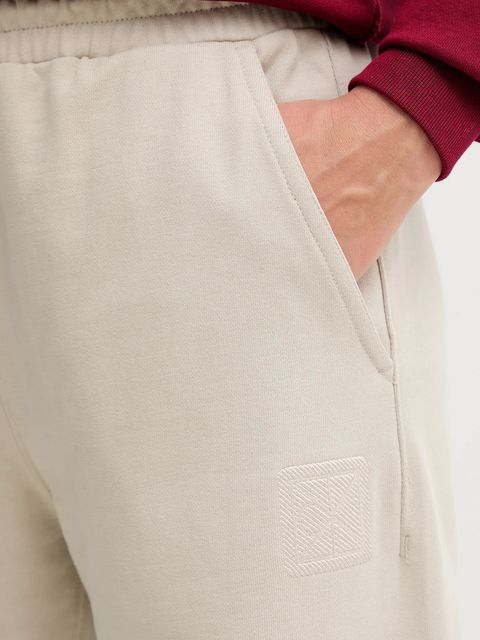 Calvin Klein spodnie dresowe damskie kolor beżowy z aplikacją LV044D205G