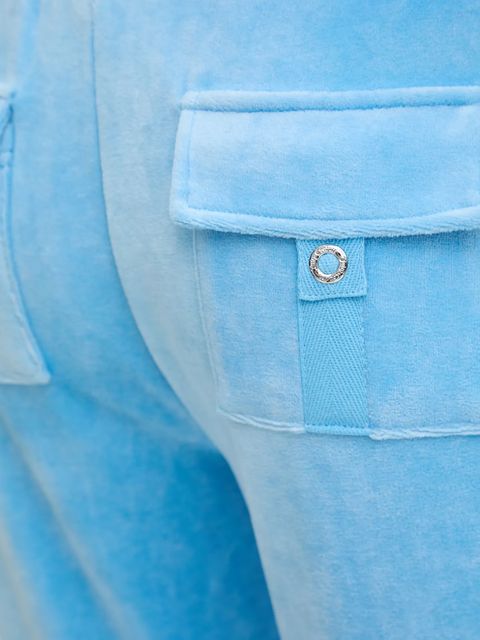 Juicy Couture spodnie dresowe welurowe CAISA LOW RISE PANT damskie kolor niebieski gładkie JCSEBJ008