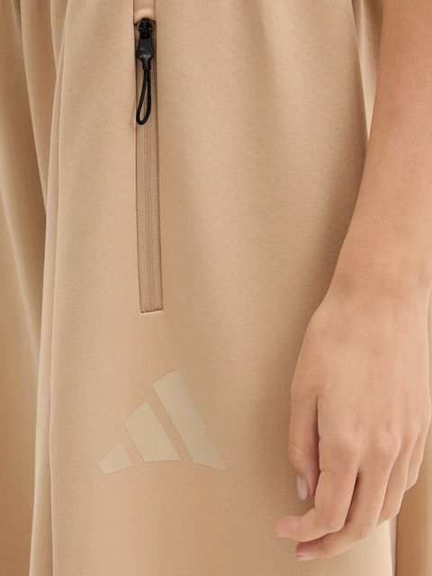 adidas spodnie dresowe Z.N.E. damskie kolor beżowy gładkie JW7770