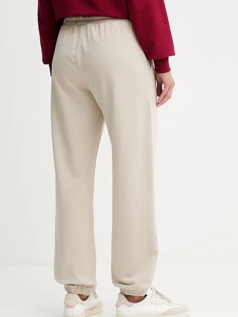 Calvin Klein spodnie dresowe damskie kolor beżowy z aplikacją LV044D205G