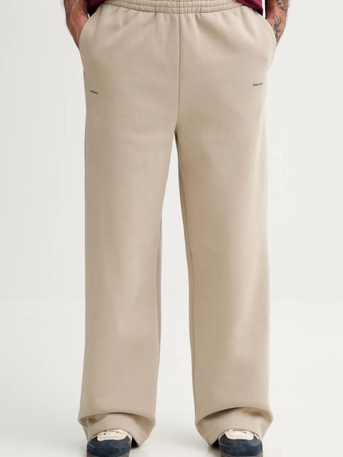 Pangaia spodnie dresowe bawełniane kolor beżowy gładkie 10002676