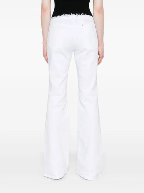 Givenchy raw-cut detail low-rise flared jeans - White
