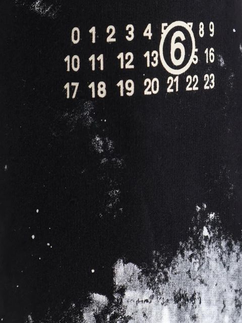 MM6 Maison Margiela paint-splatter logo-print trousers - Black