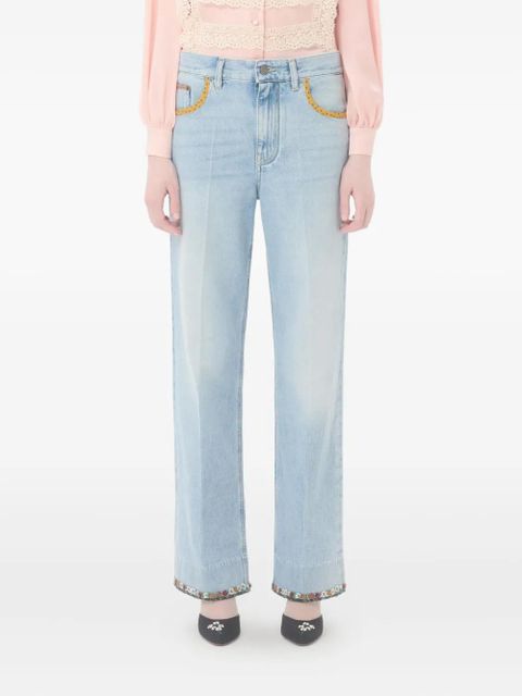 Valentino Garavani floral-hem faded jeans - Blue