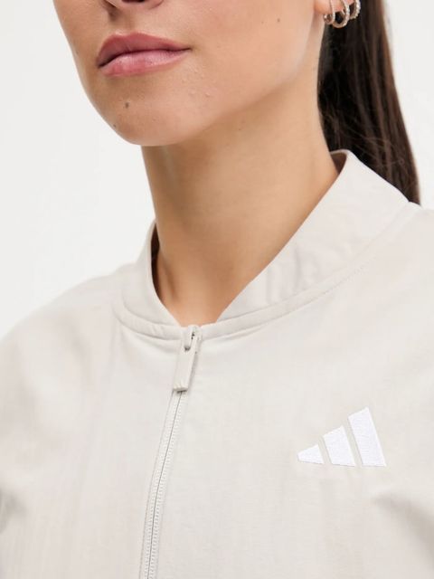 adidas kurtka Essentials kolor beżowy przejściowa oversize JE1317