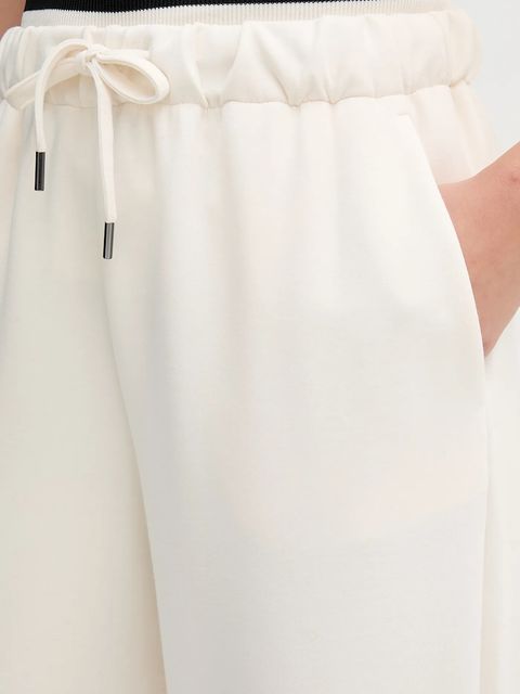 United Colors of Benetton spodnie dresowe kolor beżowy melanżowe 3QAFDF01D