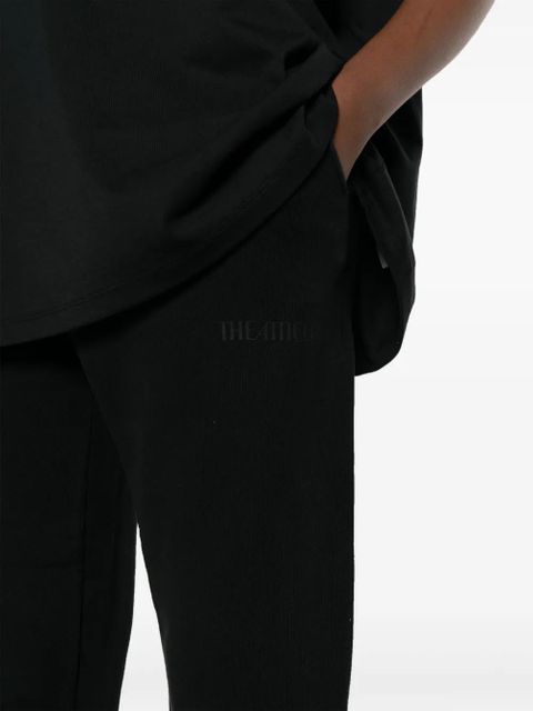 The Attico Penny logo-embossed cotton track pants - Black
