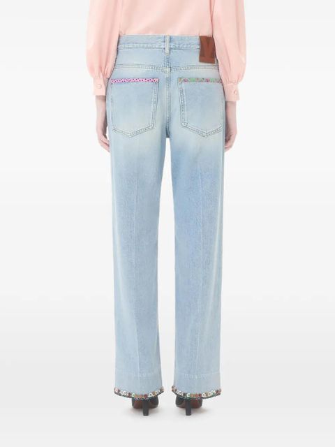 Valentino Garavani floral-hem faded jeans - Blue
