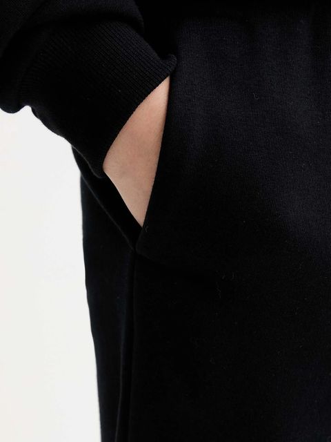 MUUV. spodnie dresowe MUUV. x Answear damskie kolor czarny melanżowe