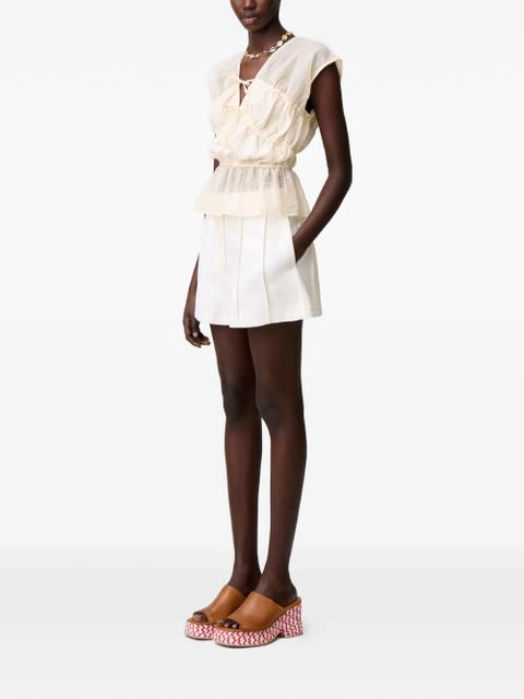 Claudie Pierlot button-fastening pleated shorts - White