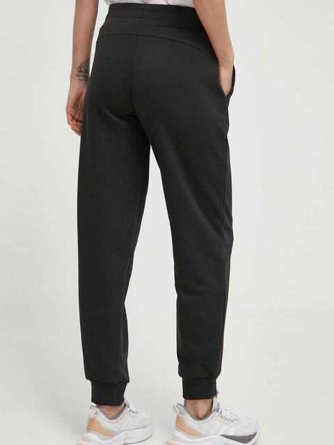 Puma spodnie dresowe kolor czarny z nadrukiem 677895