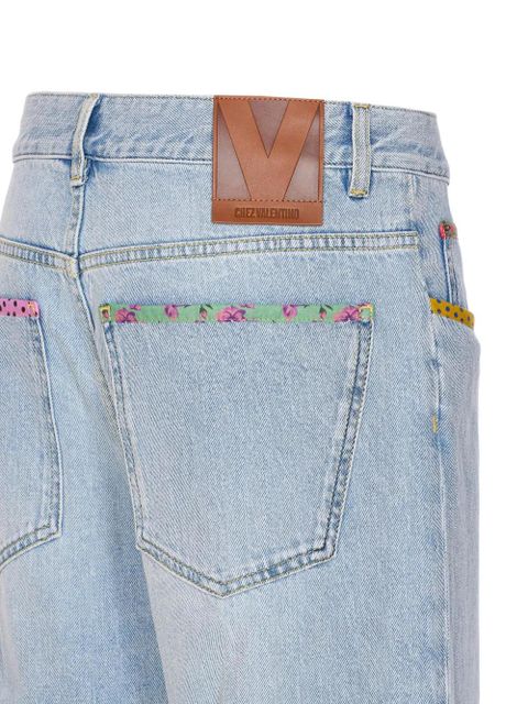 Valentino Garavani floral-hem embroidered jeans - Blue