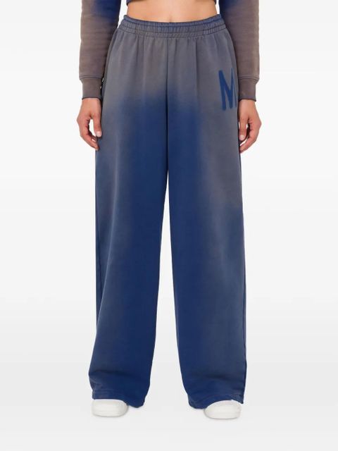 Moschino logo-detail ombre-effect track pants - Blue