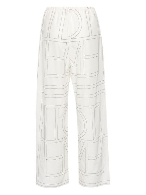 TOTEME embroidered-monogram trousers - White