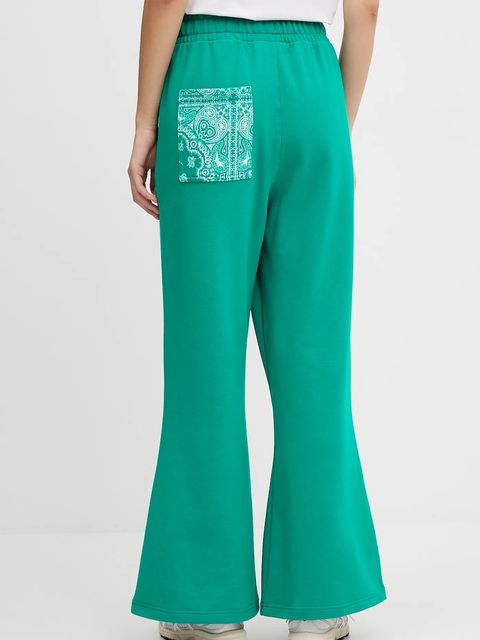 Puma spodnie dresowe bawełniane damskie kolor zielony wzorzyste 632845