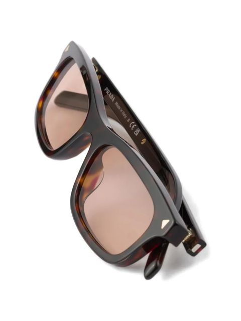 Prada Eyewear sunglasses with the iconic metal plaque - Brown