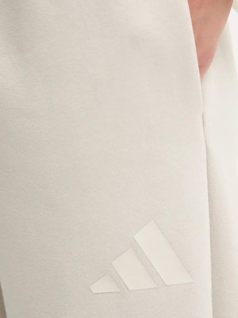 adidas spodnie dresowe Essentials kolor beżowy gładkie JD9981